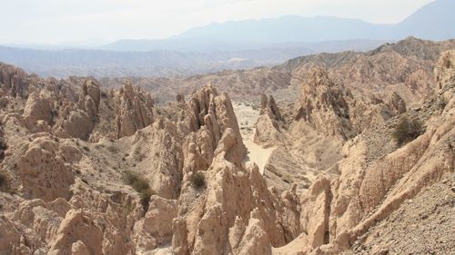 Panoramic view of rocky mountains against sky