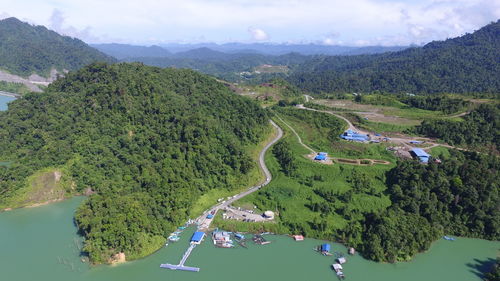 Panoramic view of green landscape against sky