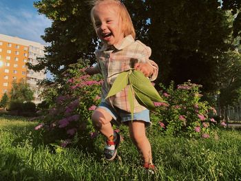 Girl sitting on grassy field