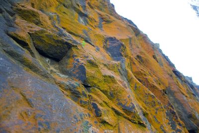 Low angle view of rock formation against sky