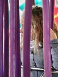 Close-up of woman wearing multi colored curtain