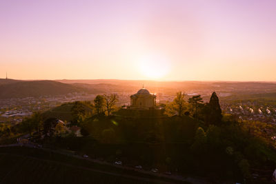 Scenic view of historic building against sky during sunset