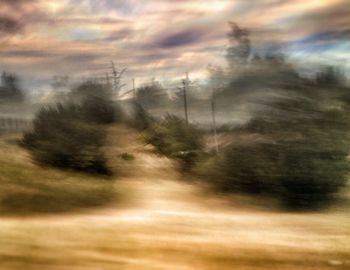 View of landscape against cloudy sky