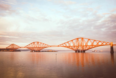 View of bridge over river during sunset