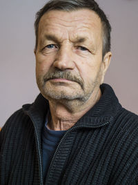 Close-up portrait of senior man at home