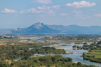 Scenic view of landscape and mountains against sky