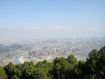 Aerial view of city against sky