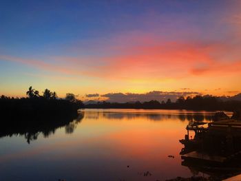 Scenic view of lake against sky during sunset