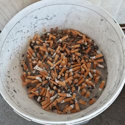 High angle view of cigarette in bowl on table