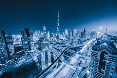 Aerial view of city buildings at night