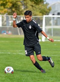 Man playing soccer on field