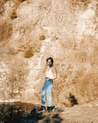 Portrait of woman standing on land