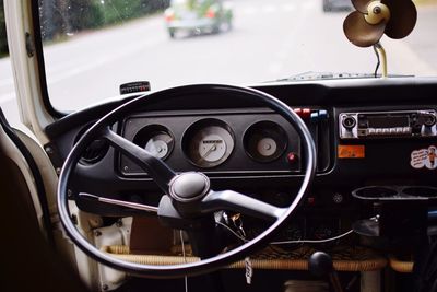 Close-up of steering wheel of vintage car