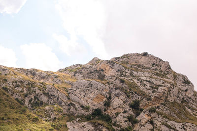 Low angle view of rock formations against sky