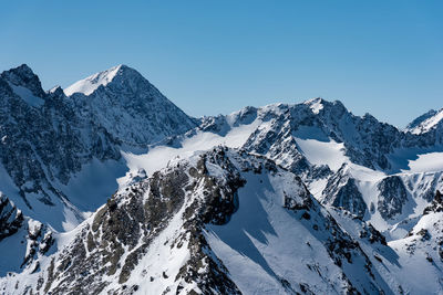 Snowcapped mountains against sky