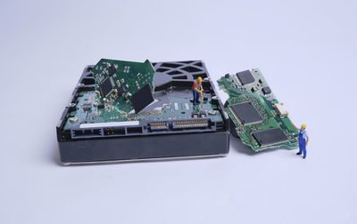 High angle view of mobile phone against white background