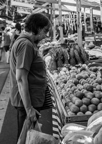 Full length of woman at market stall