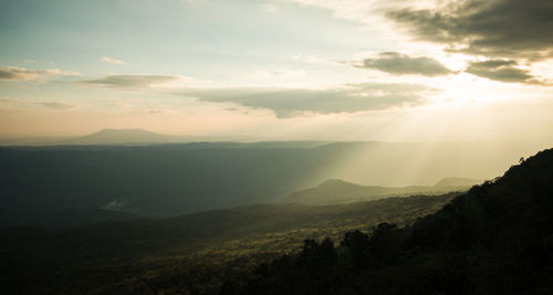 Scenic view of mountains against sky at sunset