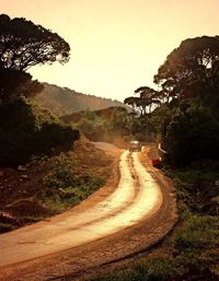 Country road leading towards mountains