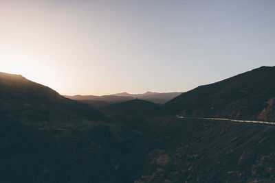 Scenic view of mountains against sky during sunset