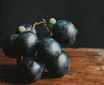 Close-up of grapes on table
