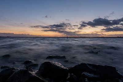 Scenic view of sea against sky during sunset