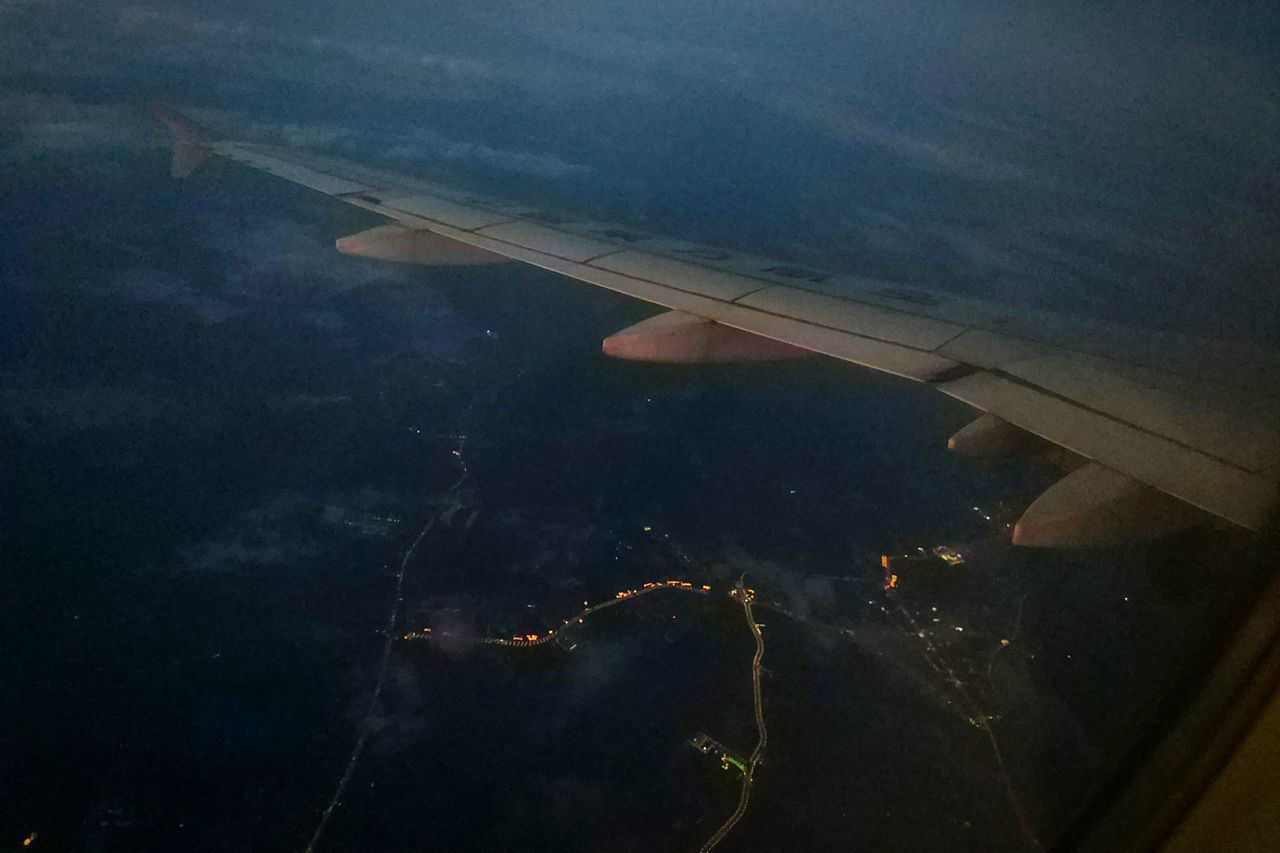 AERIAL VIEW OF AIRCRAFT WING OVER WATER