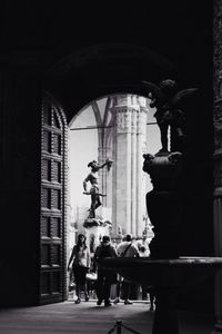 Low angle view of man standing in front of building