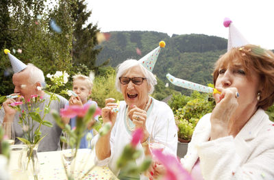 Seniors celebrating birthday oarty in garden