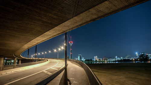 Illuminated city street at night