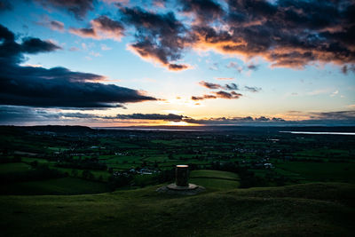 Scenic view of landscape against sky during sunset