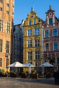 Low angle view of buildings against blue sky