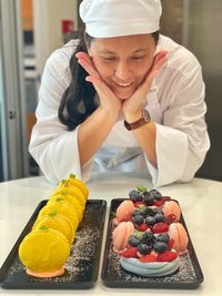 Close up of a  woman looking at the lovely macaroons