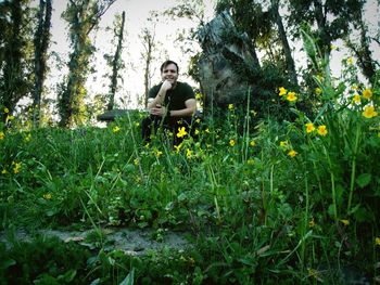 Man sitting on field