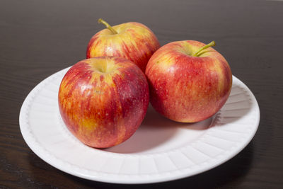 High angle view of apples in plate on table