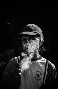 Portrait of man smoking cigarette