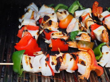 Close-up of fruits and vegetables on barbecue grill