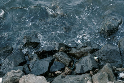 Full frame shot of rocks at shore