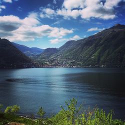 Scenic view of lake against cloudy sky