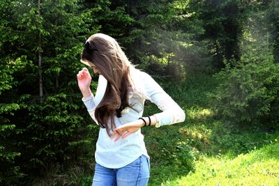 Woman standing on grass