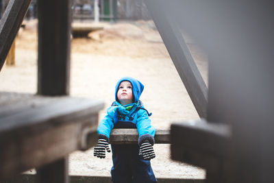 Boy in playground during winter