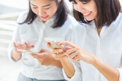 Young woman using mobile phone