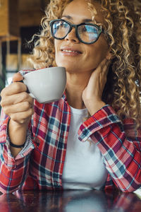 Young woman drinking coffee