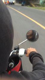 Man riding motorcycle on street