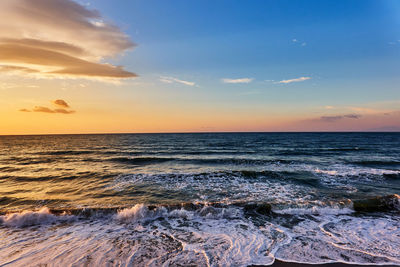 Scenic view of sea against sky during sunset