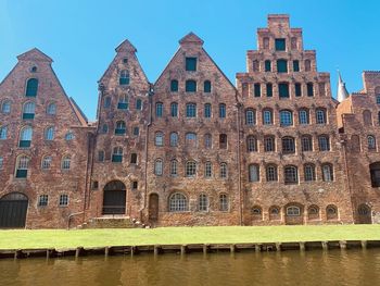 View of buildings against blue sky