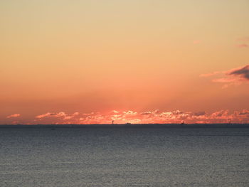 Scenic view of sea against sky at sunset