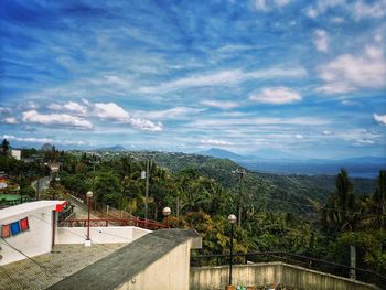 High angle view of building and trees against sky