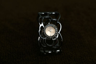 High angle view of clock on table