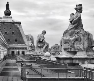 Low angle view of statue against cloudy sky